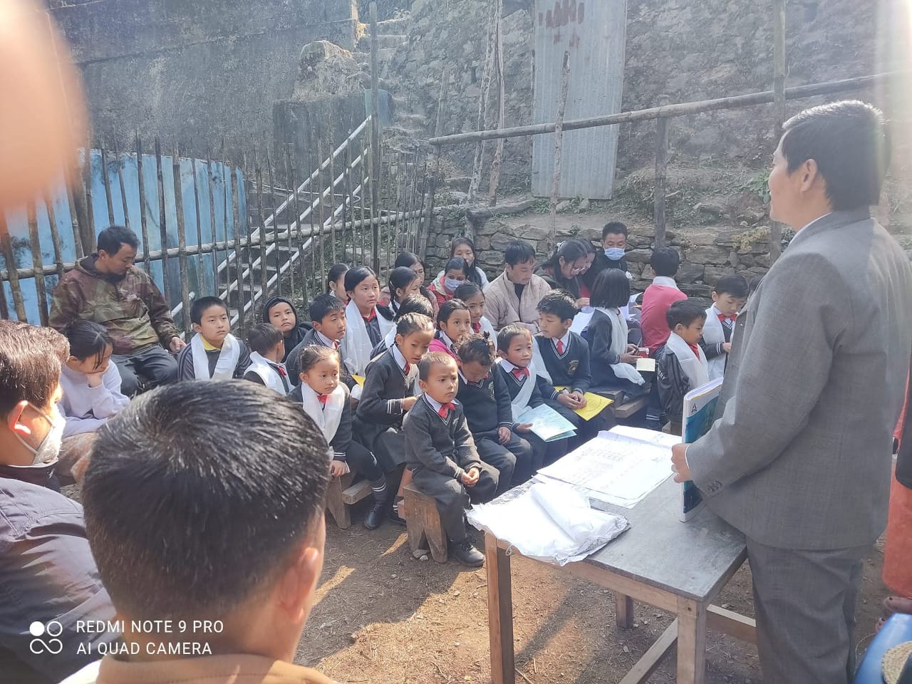 Birendra Chamling handing a prize to a student at Ray of Hope Academy's Annual Day